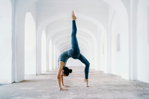 Woman practicing yoga for mental health and physical activity.